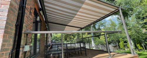 White and beige veranda above a raised wooden patio.
